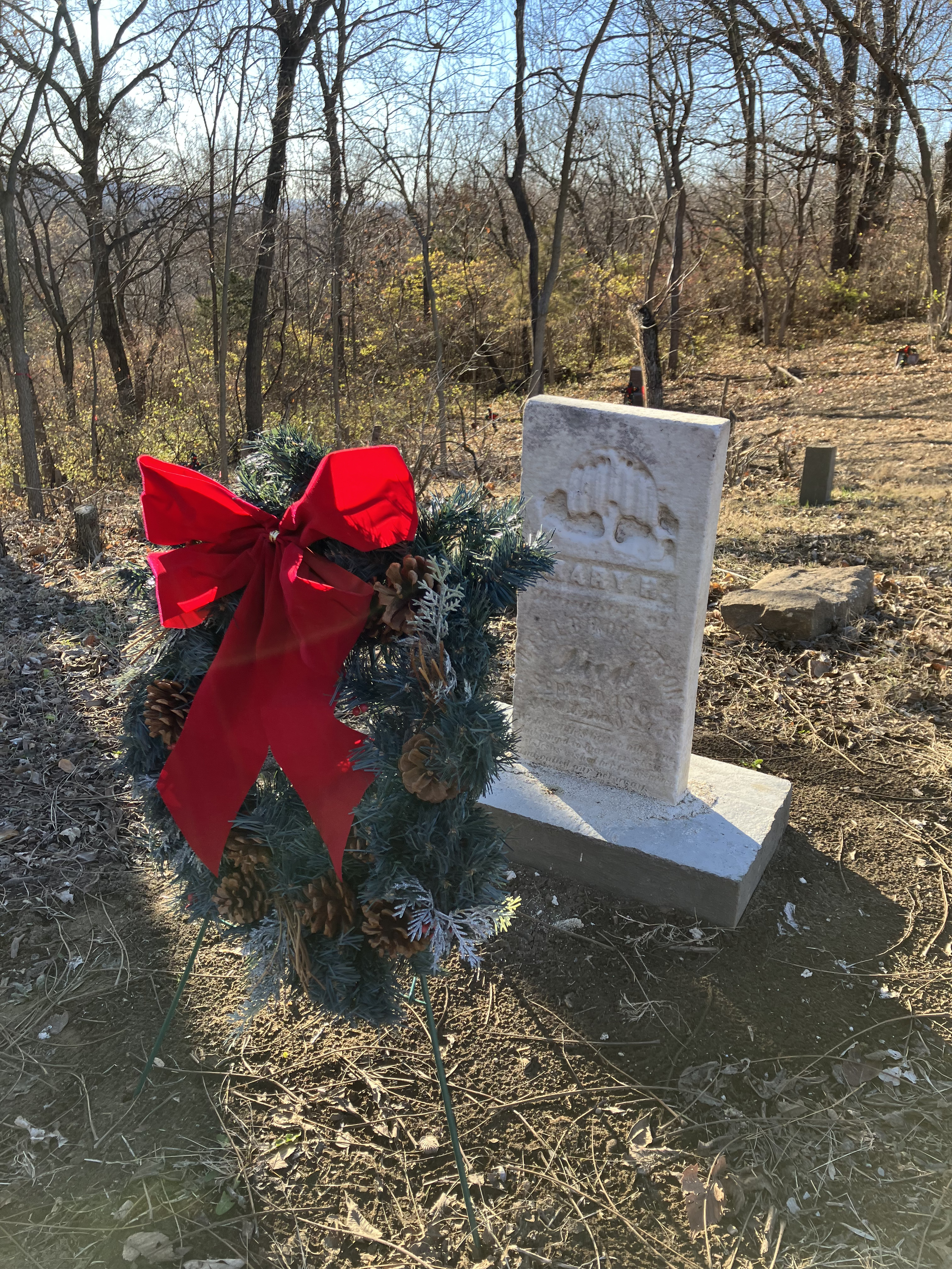 Tombstone with ribbons